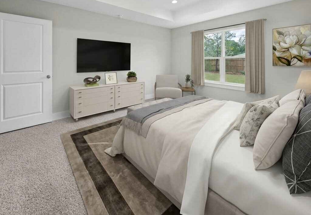 Modern bedroom with white bed, cream dresser, wall-mounted TV, large windows, and neutral decor